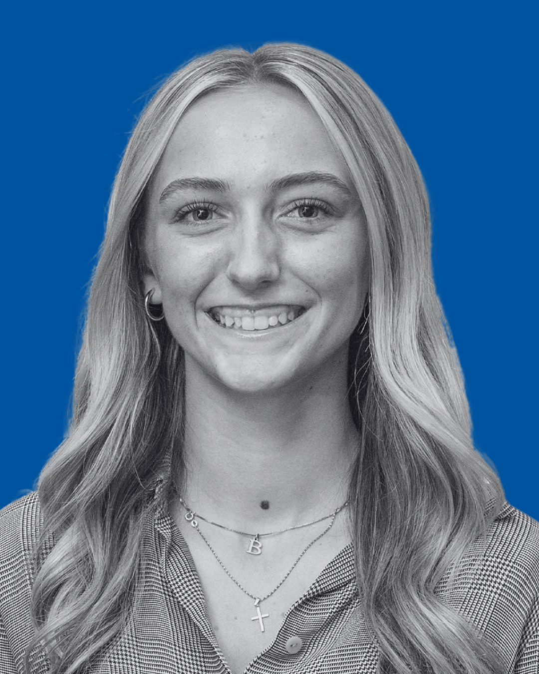 A black-and-white portrait of a person against a solid blue background