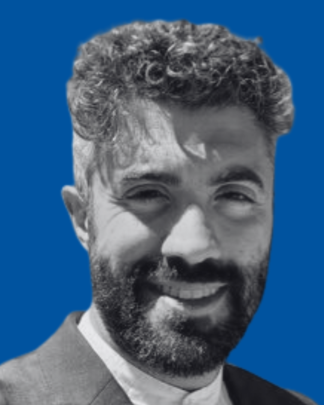 A black-and-white portrait of a person against a solid blue background
