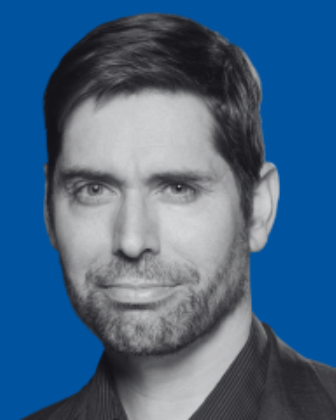 A black-and-white portrait of a person against a solid blue background