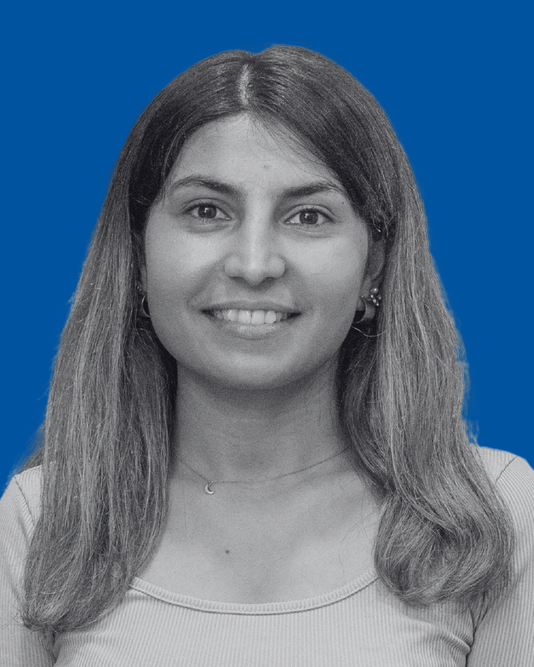 A black-and-white portrait of a person against a solid blue background