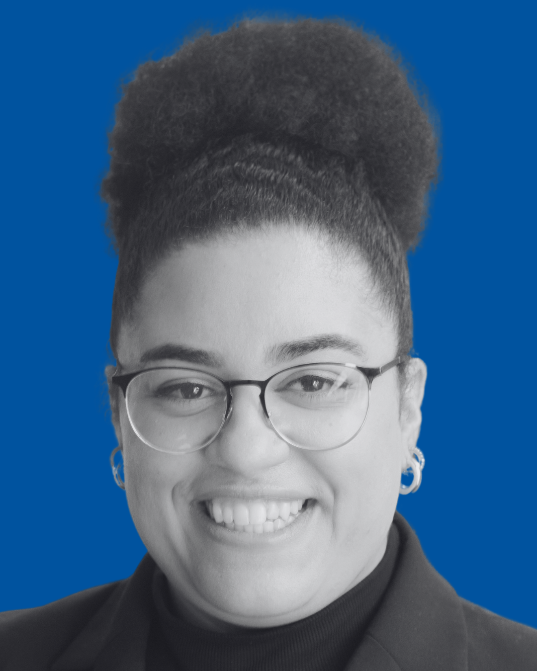 A black-and-white portrait of a person against a solid blue background