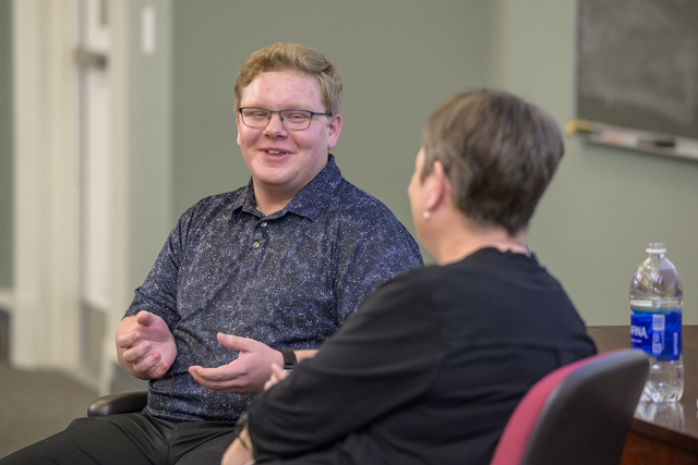 SNF Ithaca Visiting Fellow Matthew Stevens in conversation with a woman