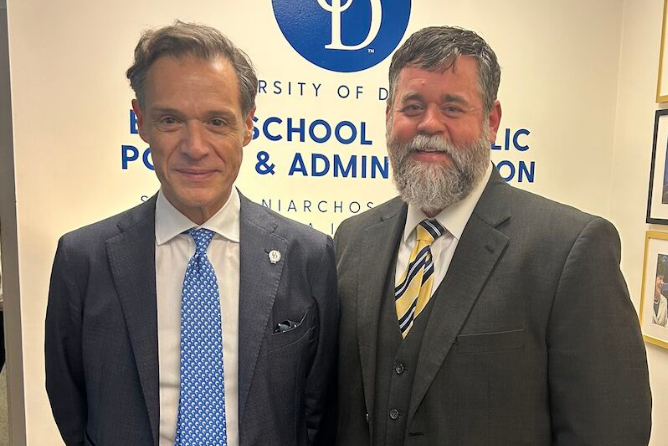 SNF Ithaca Visiting Fellow His Excellency Antonis Alexandridis, LLM smiling next to Biden School Dean Joe Trainor
