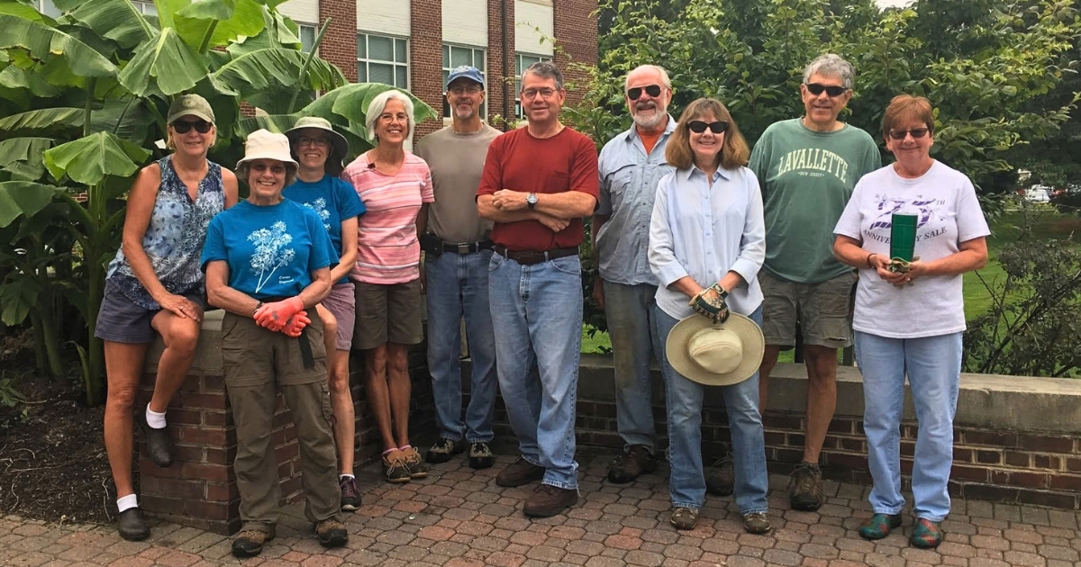 A photograph of volunteers posing together after a successful project.