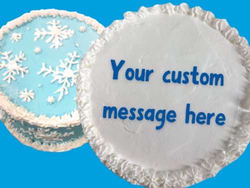 Two examples of UDairy Ice Cream Cakes, one with snowflake designs, the other plain with a custom message.
