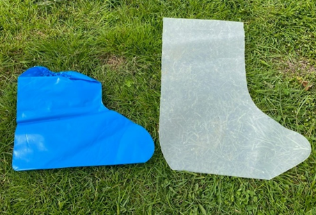 Two shoe covers on grass.