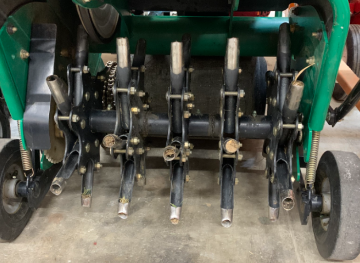 Fig. 1 - Spoons of a core aerifier