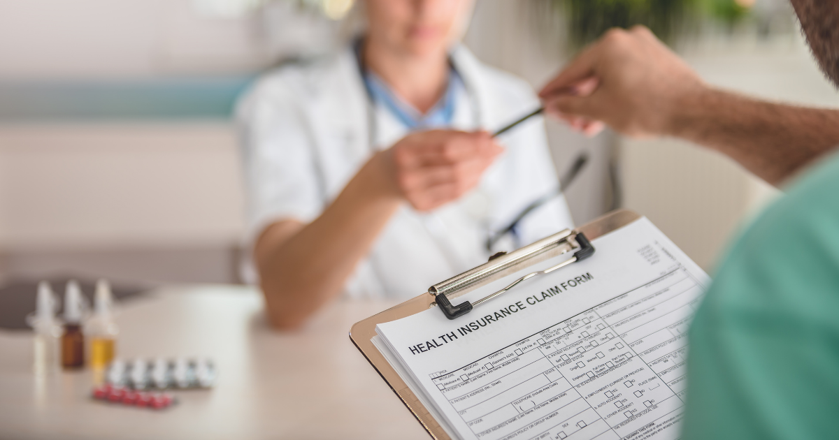 _impacts_website_properties_img_extension_1200x630 Person filling out an insurance form at the doctor's office.