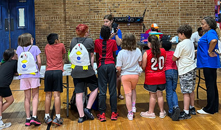 Lindsay Hughes instructing 4-H youth