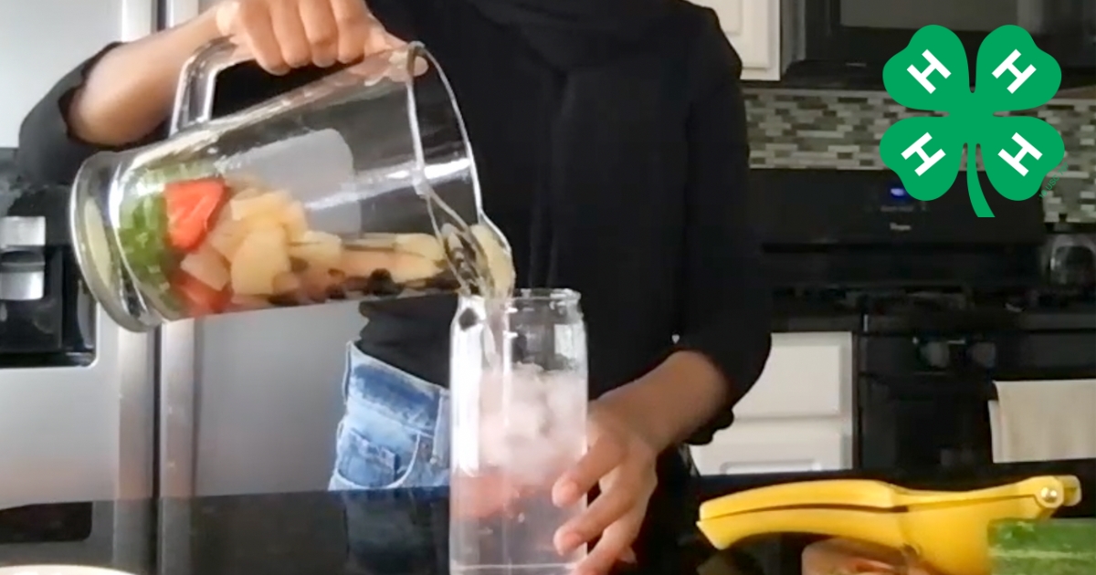 A screenshot from a video where a teenager pours water from this recipe into a cup.
