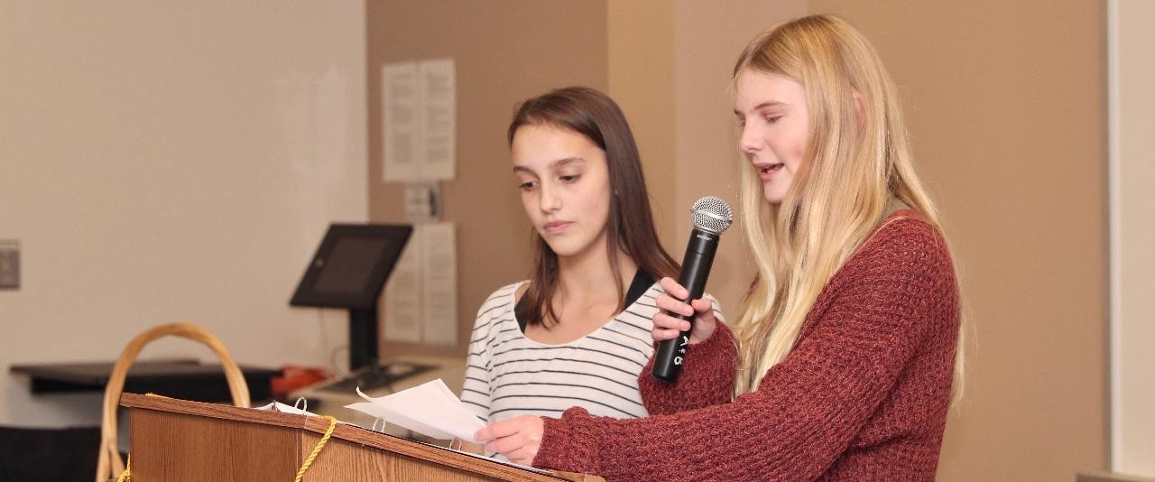 4-H students speaking at an event