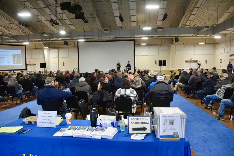 Ag week main confrence room with crowd sitting and listening