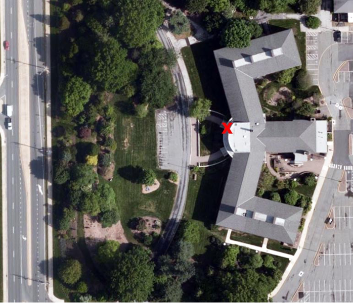 An aerial image of Townsend Hall with a red X to the north of the front steps of the building.