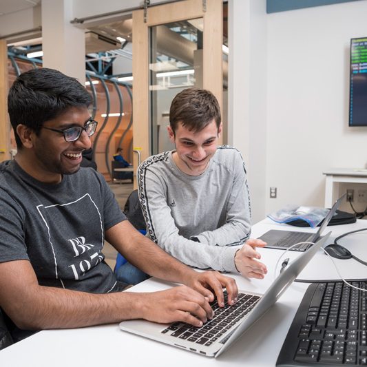 Dr. Andy Novocin teaches students developing and practicing cybersecurity skills to make them more “ethical” hackers in the world of cybersecurity in the iSuite at Evans Hall, Friday, March 22nd, 2019.  Students are: Dan Goodman (gray long sleeve), Vineeth Gutta (black shirt, khakis), Landon JOnes (black jacket), Ryan Geary (green crewneck), Thomas Pisklak (striped t-shirt), Isabel Navarro (red pants, brown blazer), Collin Clark (jean jacket, nose piercing), And Alena Gusakov (red shirt, jeans)  (PHOTO RELEASES WERE OBTAINED ON ALL PICTURED.)
