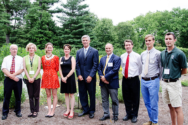 Celebrating the research collaboration between UD and Mt. Cuba Center are (from left) Doug Tallamy, Eileen Boye, Emily Baisden, Deborah Delaney, UD President Patrick Harker, Mt. Cuba Center Executive Director Jeff Downing, CANR Dean Mark Rieger, Owen Cass and George Coombs.