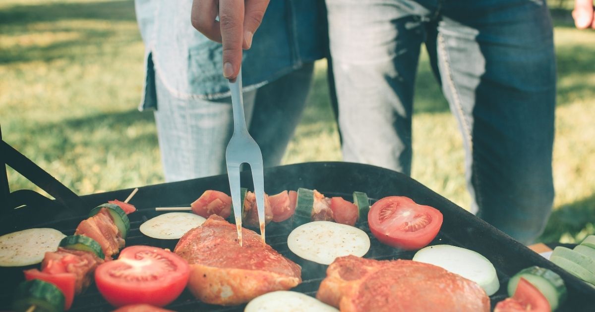 A family grilling outside