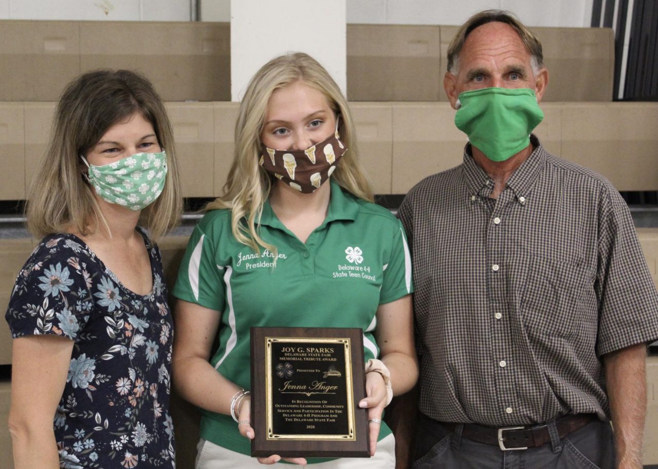 Jenna Anger poses with her award standing between Alex Gooden and Lindsay Hughes.