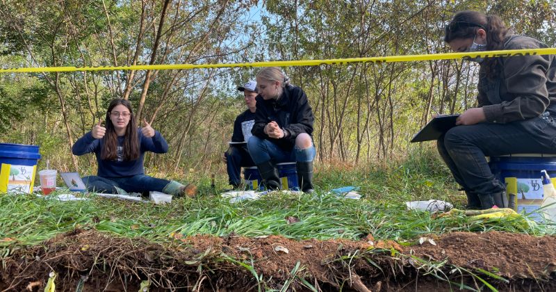 Katie Mina, Jake Gioffre, Duke Williams and Zoe Bara go over the soil description.