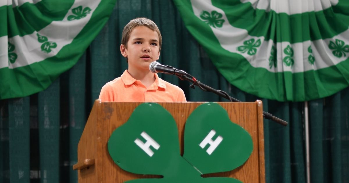 A 4-H member speaking at the Delaware State Fair public speaking competition.