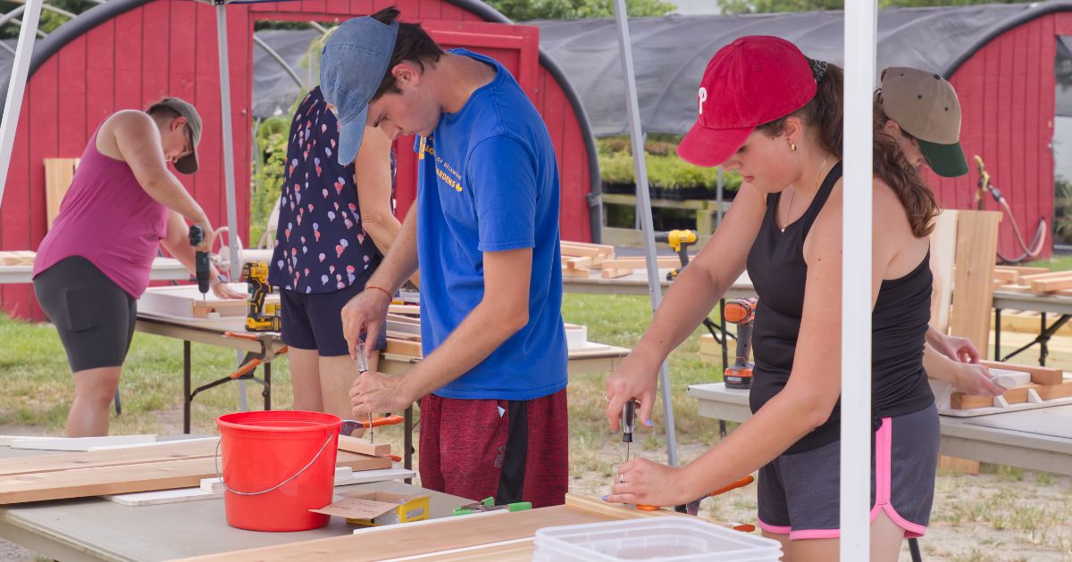 UD Botanic Gardens interns build Adirondack chairs.