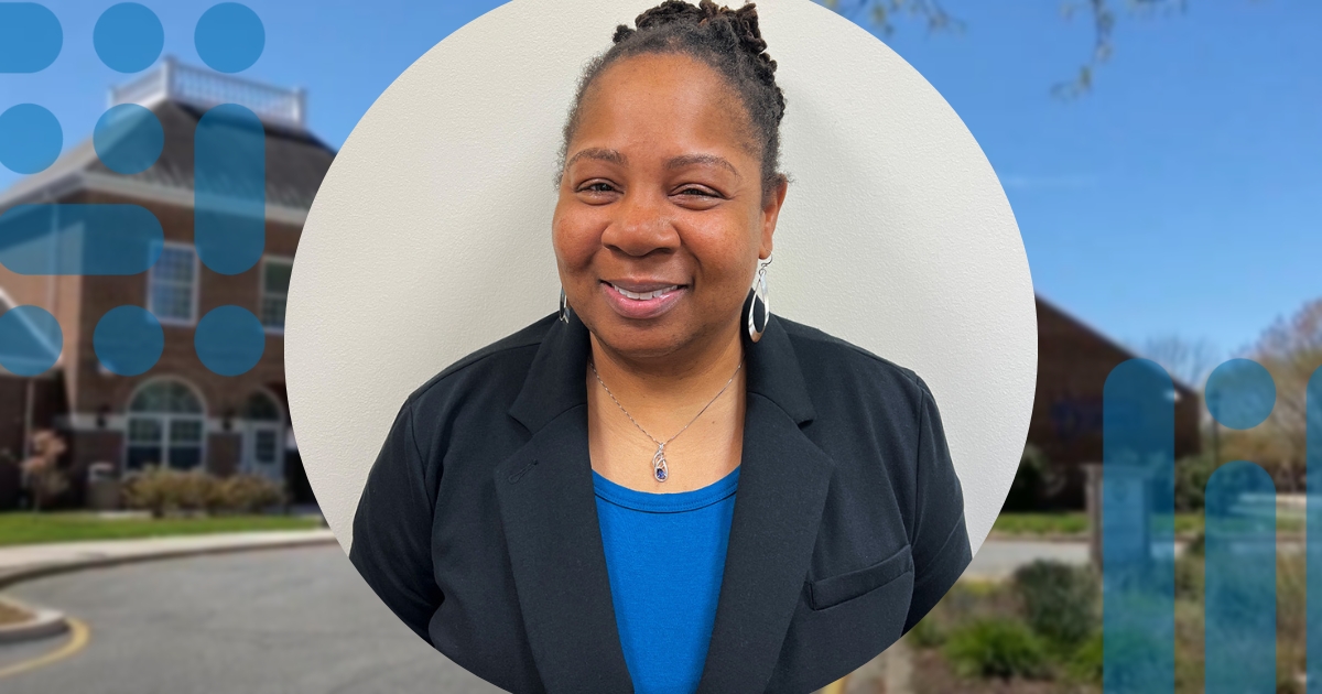 A profile image of Jennifer Seabrook-Scott in front of an image of the Paradee Dover office.