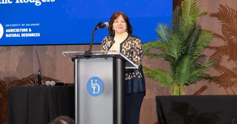 Michelle Rodgers speaks at the podium in the University of Delaware Audion