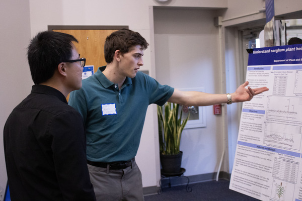 Joseph Romano presents his research poster.