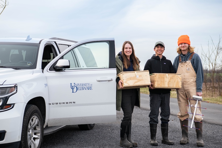 Graduate students Kai Victor and Grace Muench work closely with groups participating in the reintroduction plan, including collaborating with Will Krohn (right), a technician at Letterkenny Army Depot assisting with habitat management and tracking. 