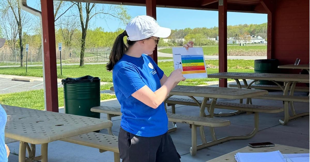 An image of Sarah Goldring explaining the intensity chart at a local Walk and Roll