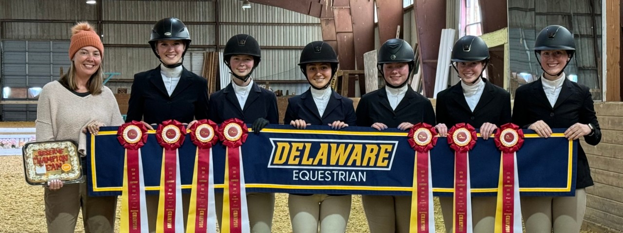 The 2024 Delaware Equestrian National Team taken by Pam Lawrence University of Delaware National Equestrian Team holding awards