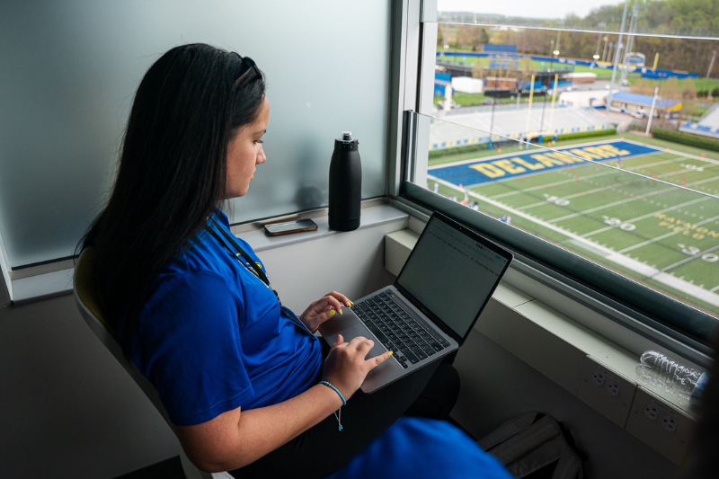 Student intern at UD Football game Student intern at UD Football game