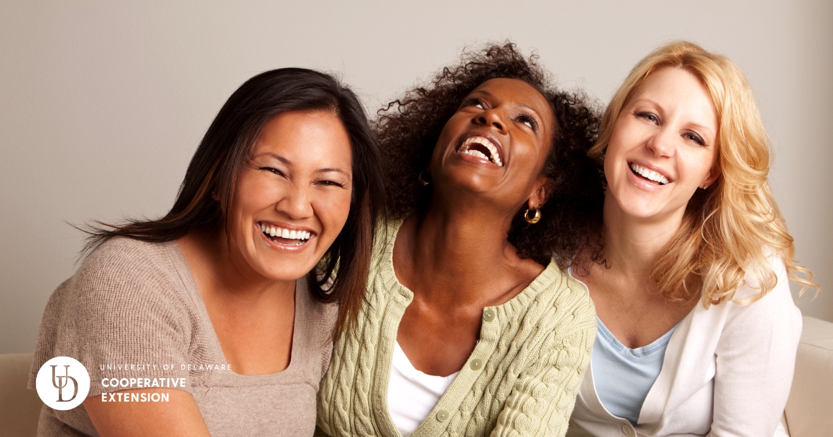 Three diverse woman laughing together Three diverse woman laughing together