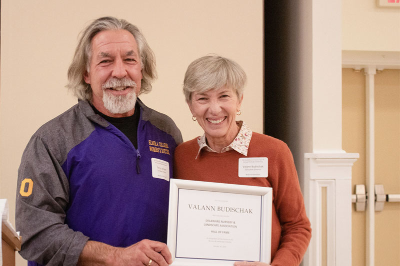 DNLA President Terry Lemper presents 2025 co-inductee Valann Budischak to the Hall of Fame. DNLA President Terry Lemper presents 2025 co-inductee Valann Budischak to the Hall of Fame.