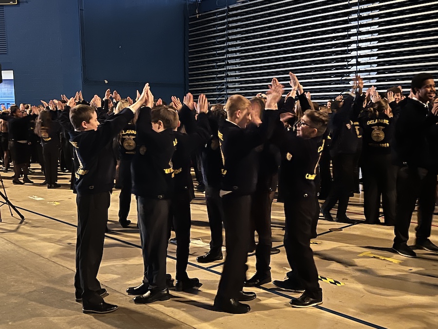Young students play a game together during an icebreaker.
