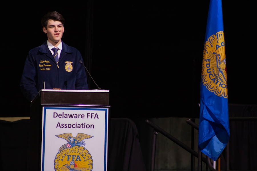 An FFA officer speaks at a podium.