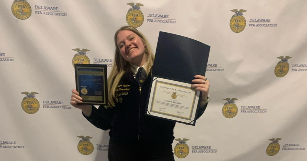 Weldon posing with her award.
