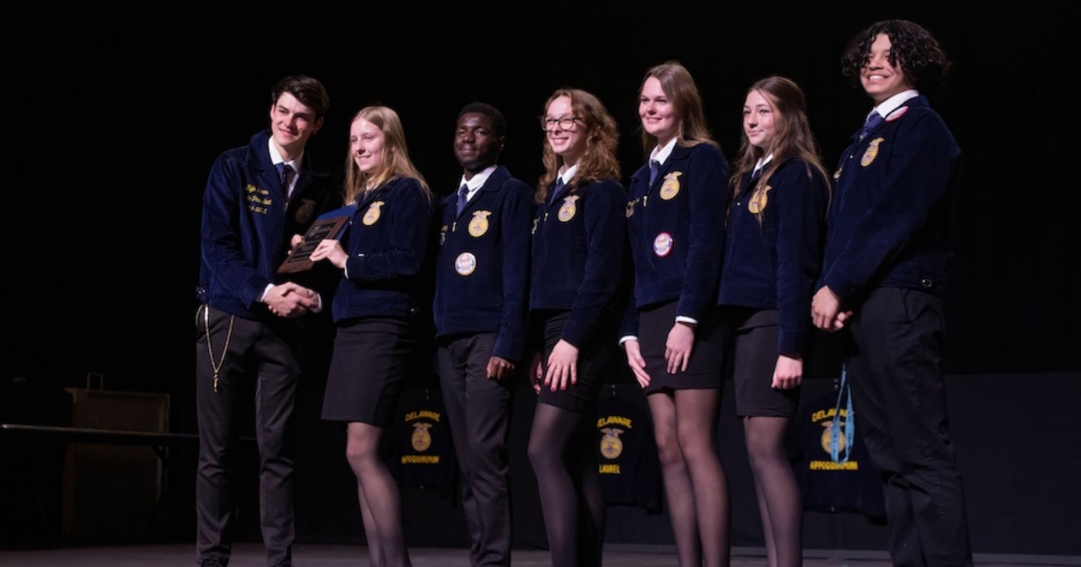 ffa-convention-aem-properties-metadata-canr-1200x630px - 1 Seven FFA officers from different states pose together with an award.