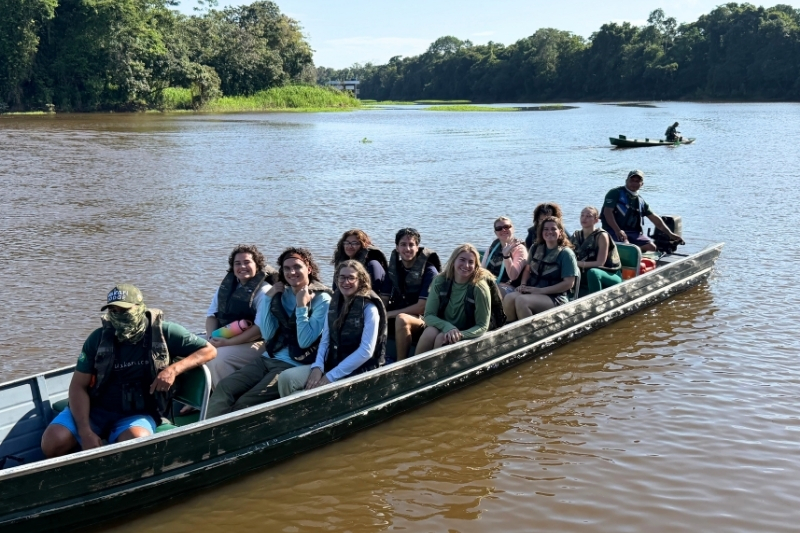 Students are on a boat in water.