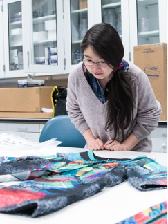 Yoo Jin Choi examines a Korean textile