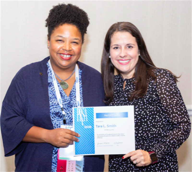 Tara Smith (left) receiving an award