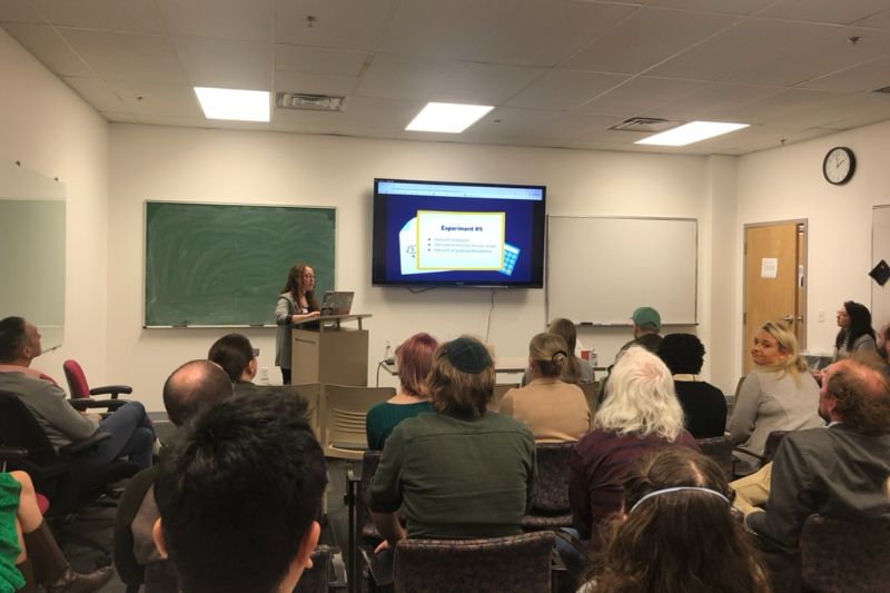 Linguistics speaker presenting to group in a classroom