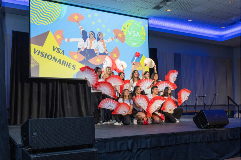 Students from UD’s Vietnamese Student Association (VSA) perform a dance with traditional fans.