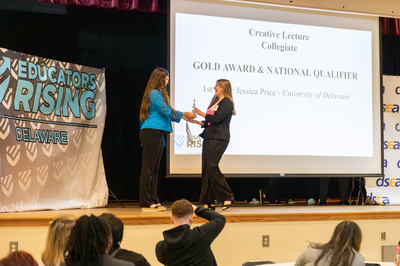 Jessica Price receiving award on stage