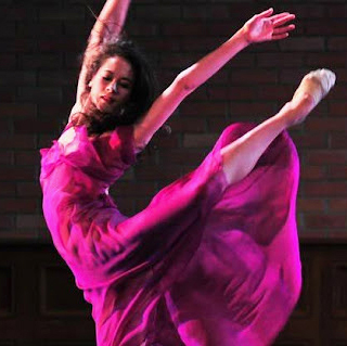A dancing ballerina in a pink costume