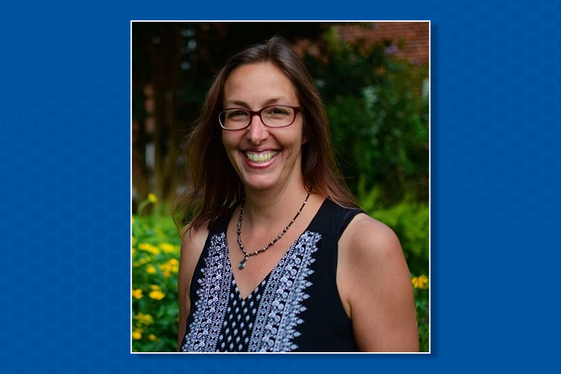 Angela Seguin headshot on blue background