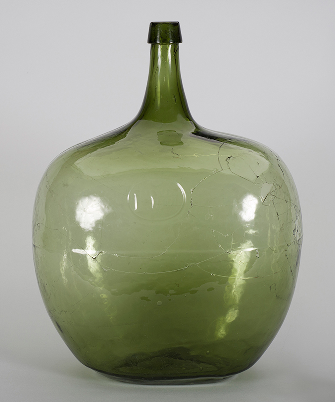 A restored green glass jug