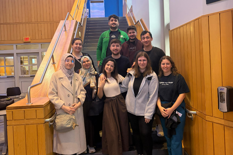 Nur Sima Ovali Ozturk with ELI and UD students at an Iftar gathering to break their fast during Ramadan.