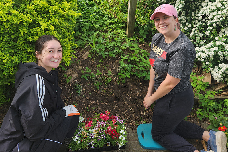 Emelia Van Slyke and Rose Alsleben at work in the Sister Cities Garden in Brandywine Park, Wilmington. 