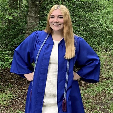 Student in blue graduate gown