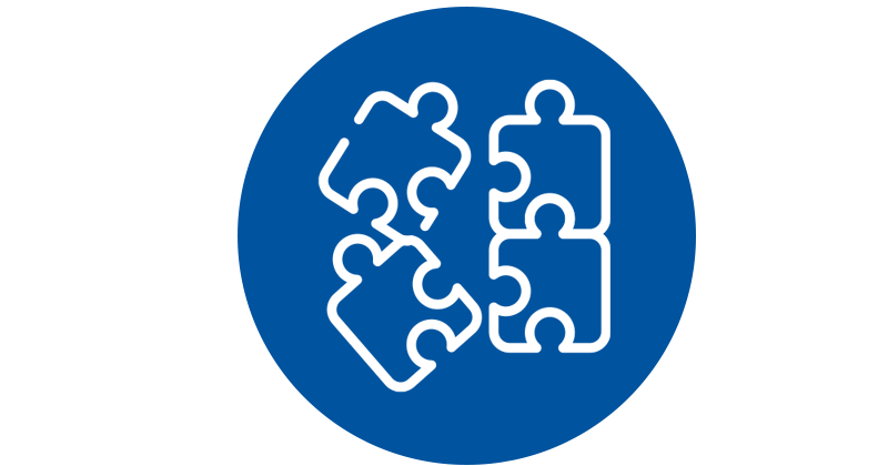 ICMH-Clinc Diagnostic Assessment Services Illustration in white over blue circle of four partially connected jigsaw puzzle pieces